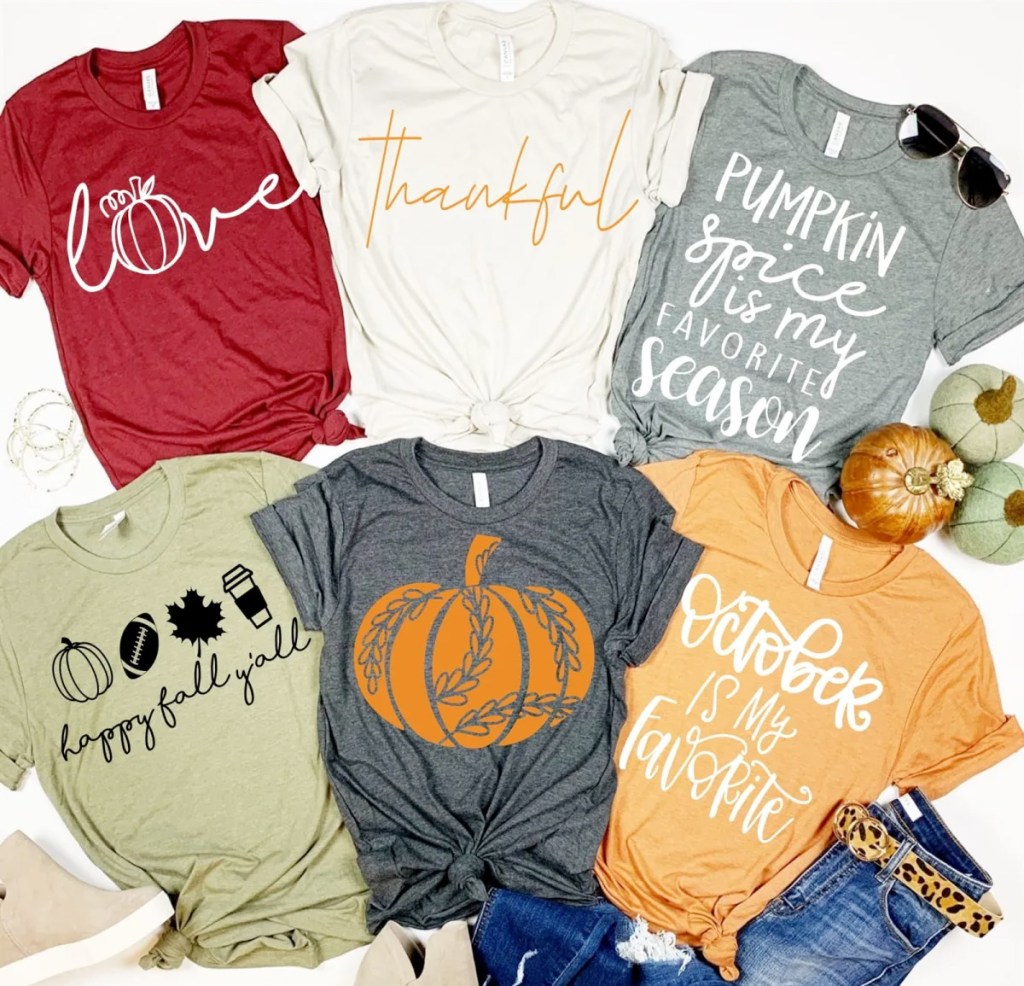 assortment of six womens tops with fall theme sayings and pumpkin graphics on them