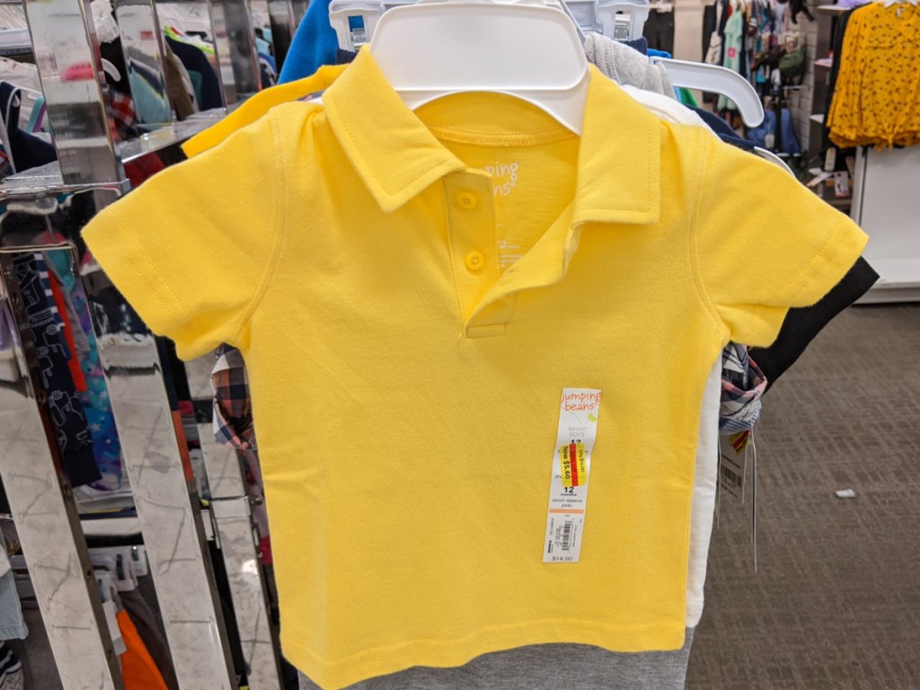 baby boys yellow polo shirt hanging in store