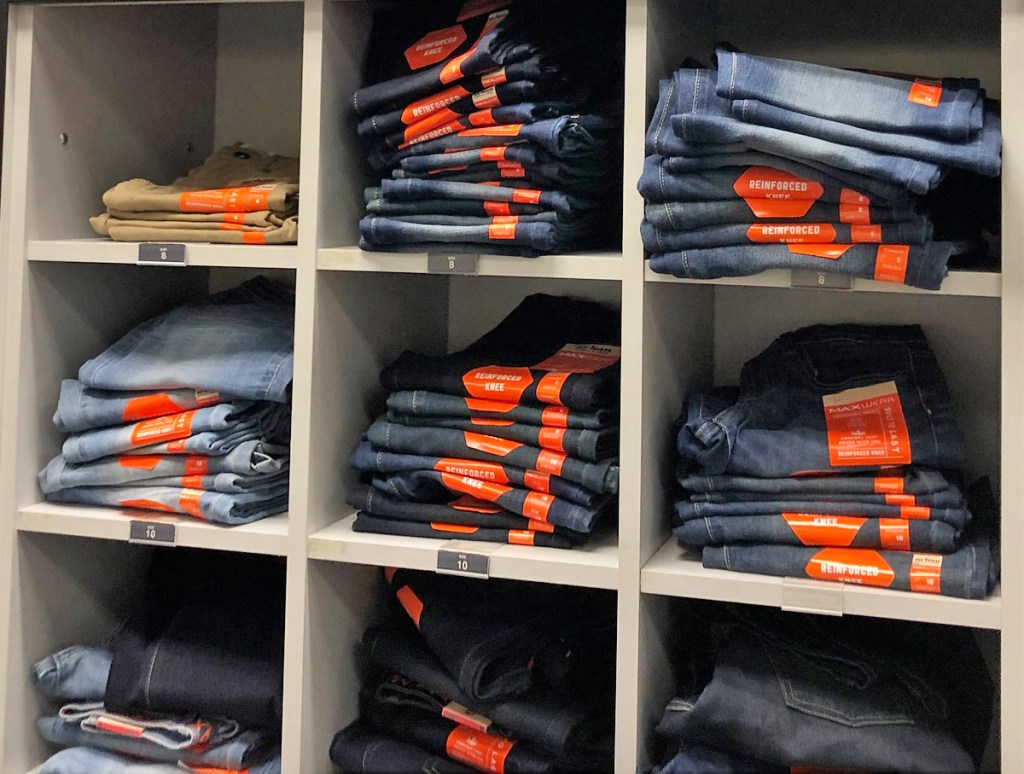 store display cubbies full of folded pairs of boys jeans