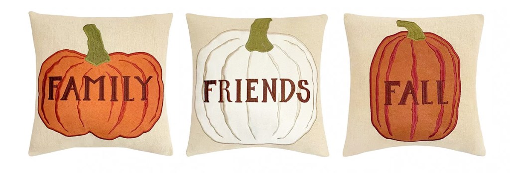 three pumpkin throw pillows that say family, friends, and fall on them