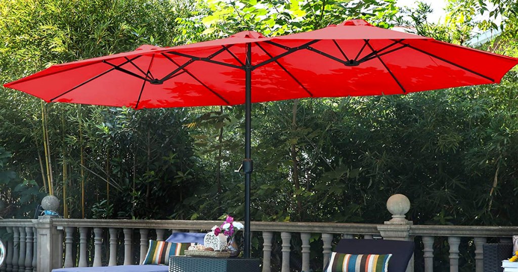 red extra-large patio umbrella in backyard