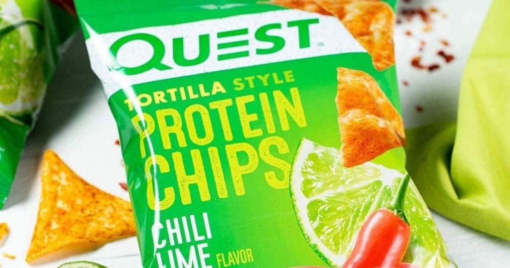 bag of Quest Protein chips with chips and limes around it