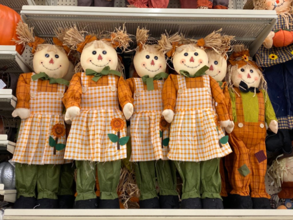 girls scarecrow decor hanging in store