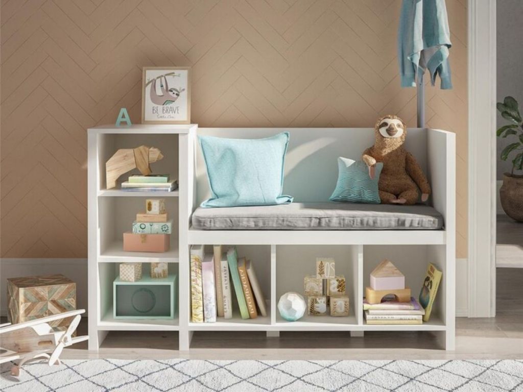 white kids storage bench filled with items