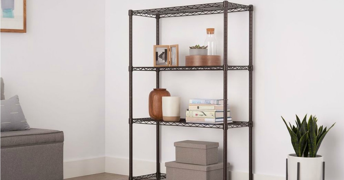 set of wire shelves shown in living area with books, decor, and frames