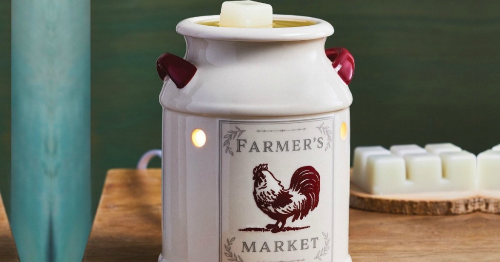Large farmhouse theme wax warmer on table near wax melts