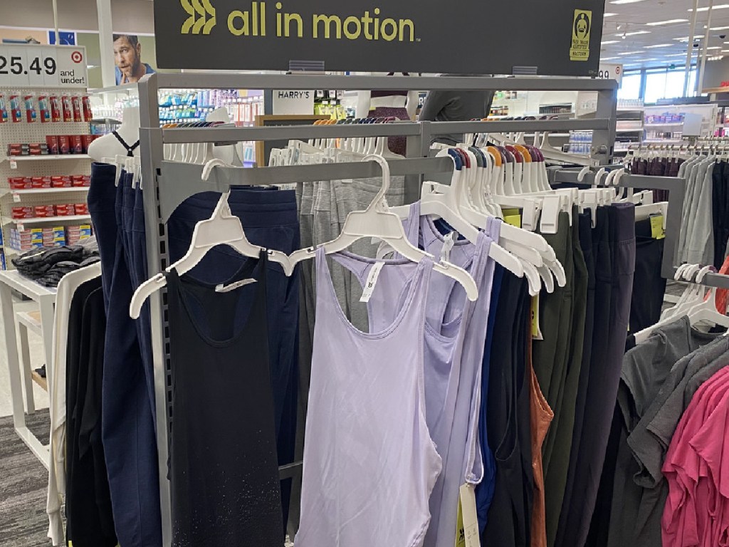 store display with tank tops hanging