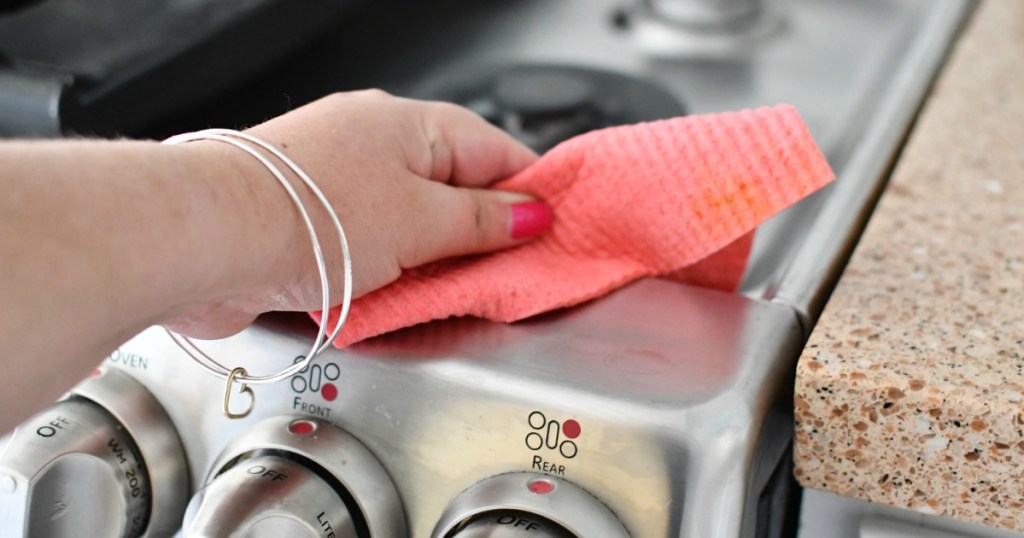 cleaning stainless steel range with swedish dishcloth 