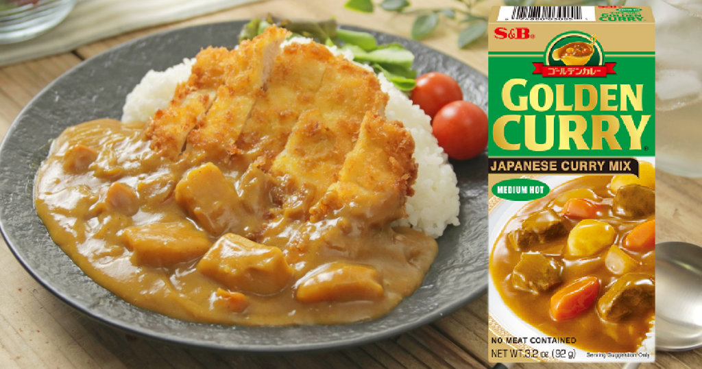 plate of chicken, and rice next to box of curry