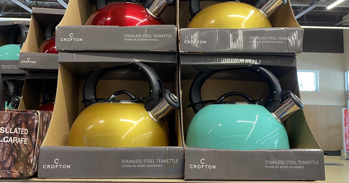 shelf display of tea kettles in bright colors