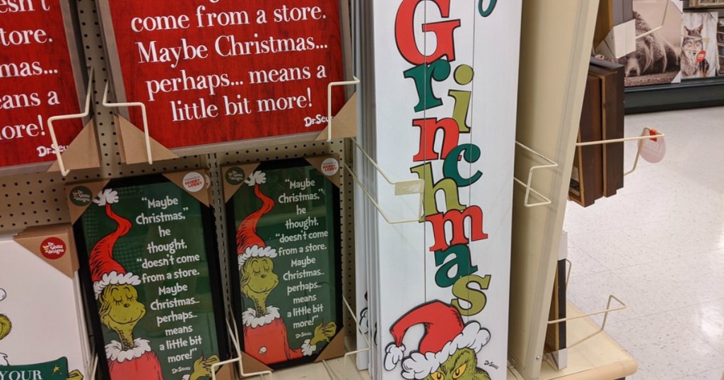 grinch themed signs and decor on store display
