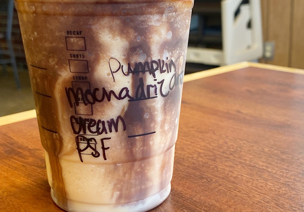 pumpkin frappuccino cup with the order written on the cup