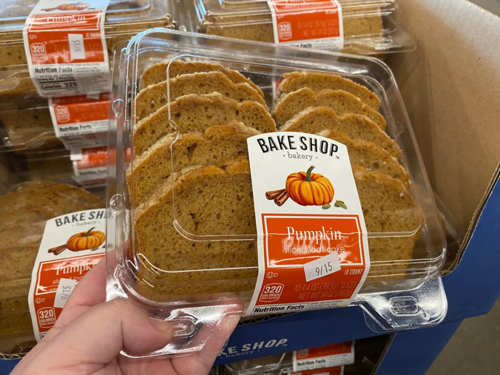 hand picking up package of bread cut into loaf slices