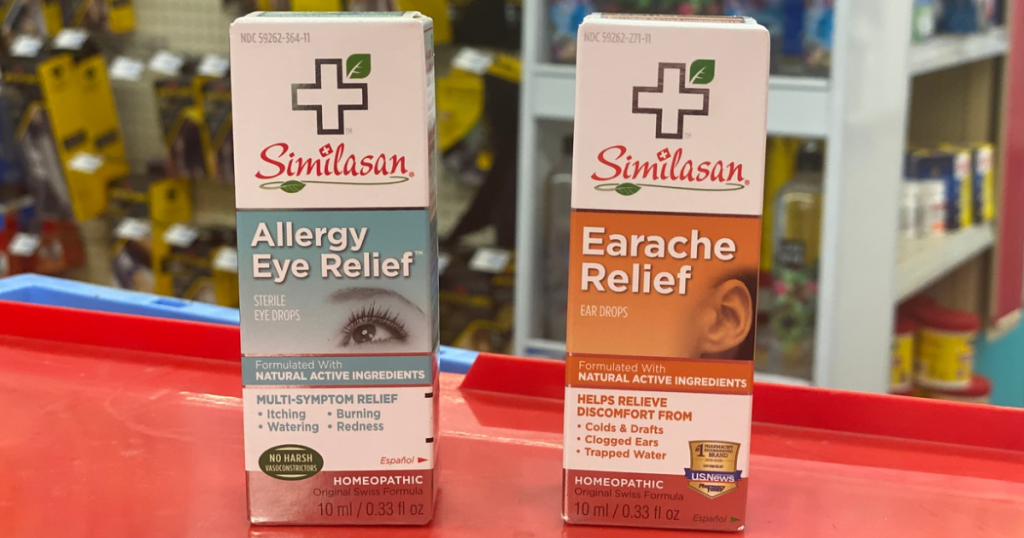 2 boxes of kids products for eyes and ears on red table