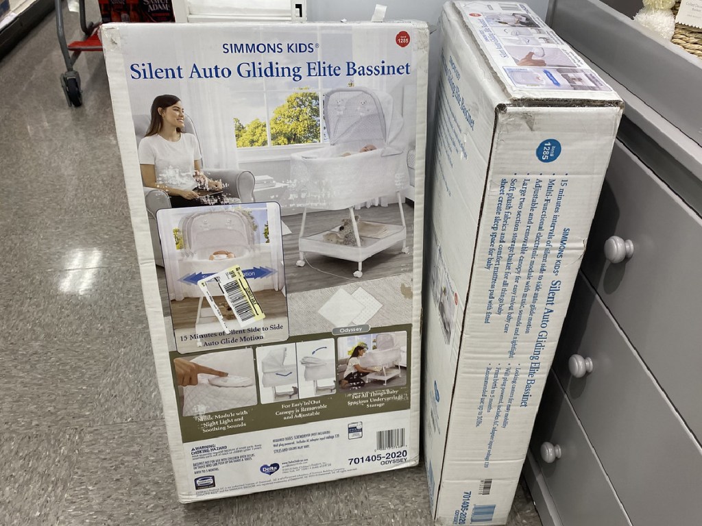 box with baby bassinet inside store