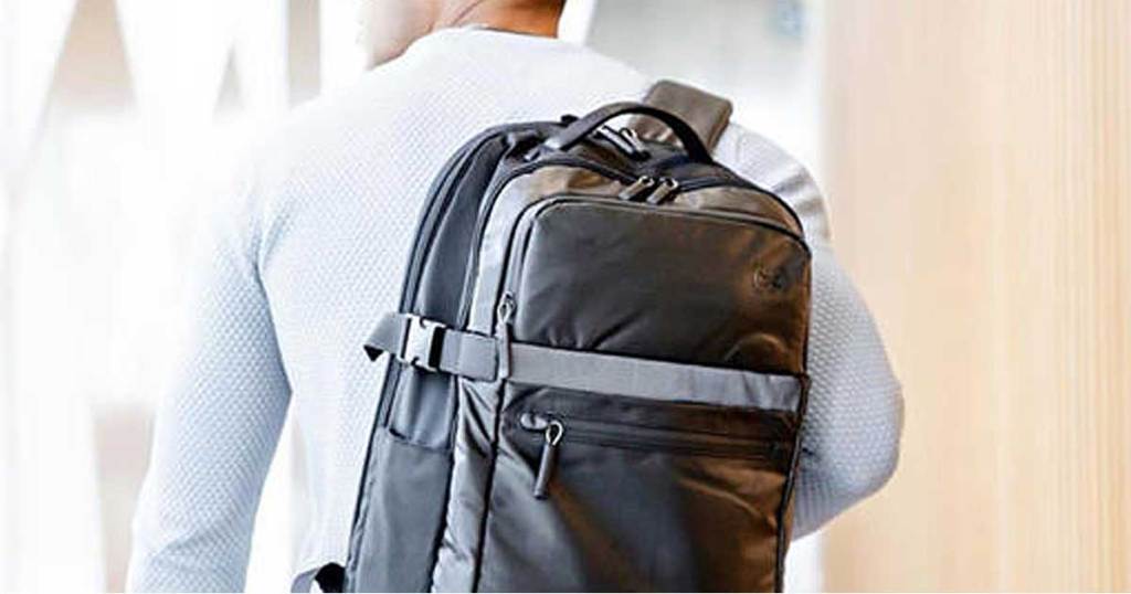 man wearing a grey backpack