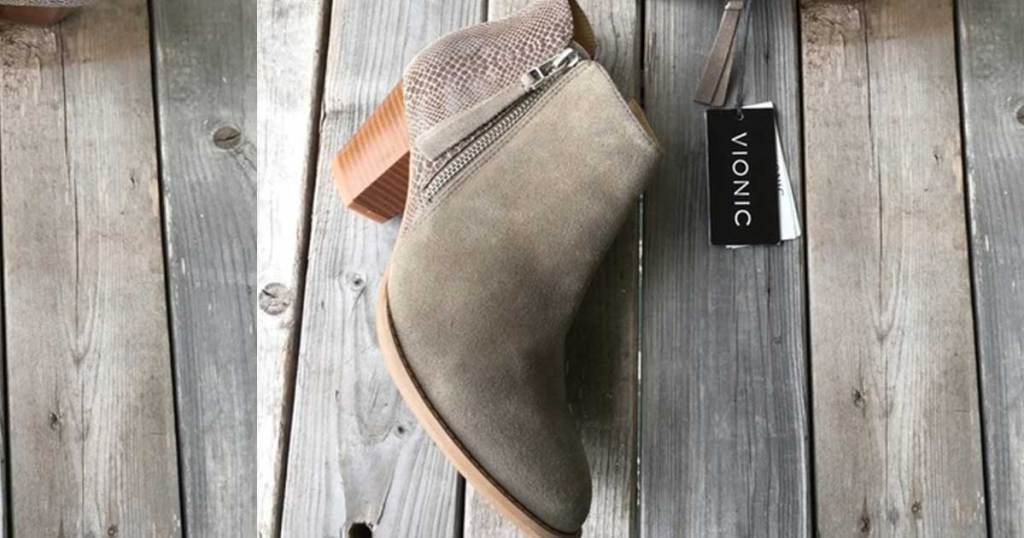 women's bootie on wood deck