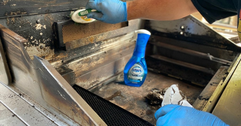 washing a grill with powerwash