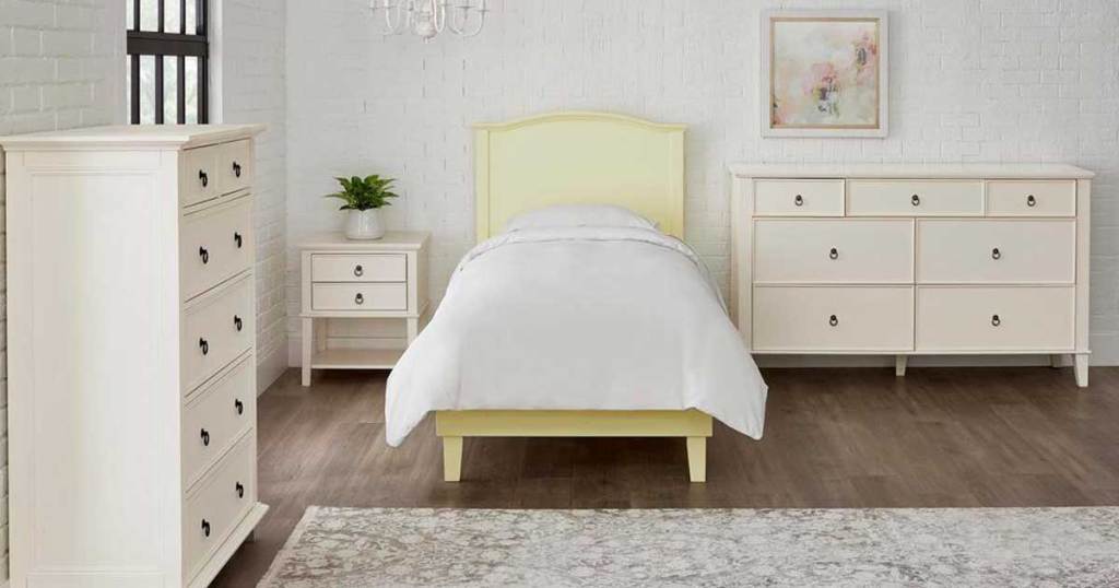 yellow bed with curved in a bedroom