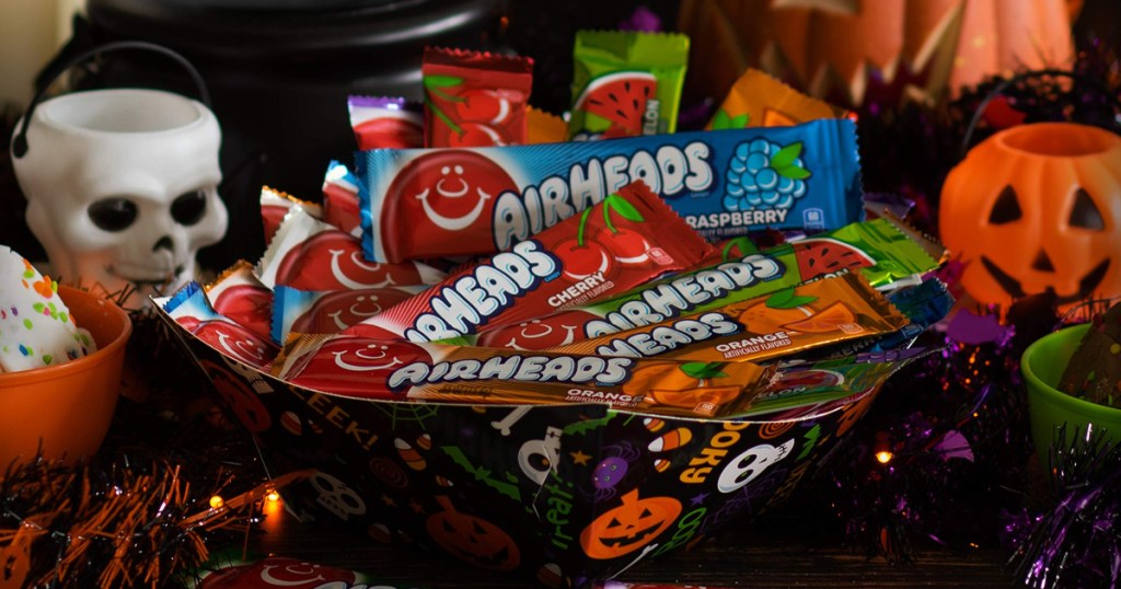 large bowl of full size AirHead Candy Bars surrounded by Halloween decor