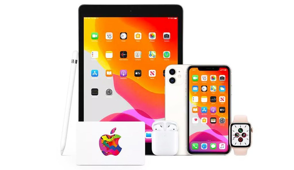 white apple gift card in front of ipad, iphones, and apple watch