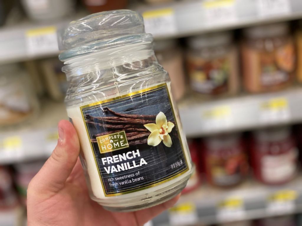 hand holding a jar candle
