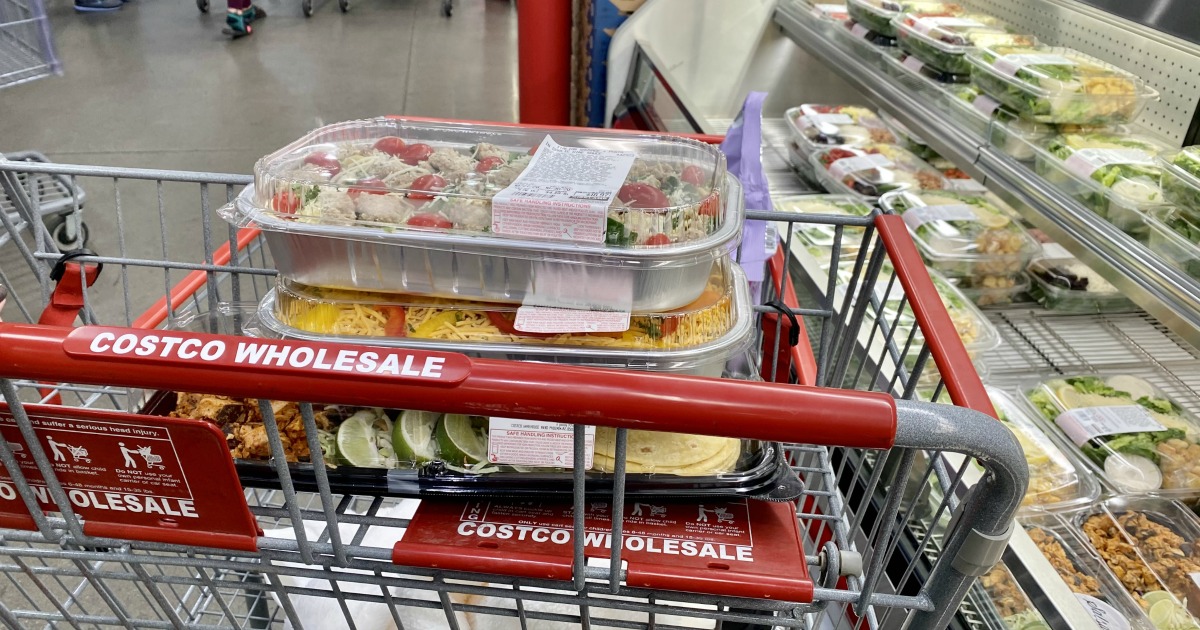 Shopping cart with premade Costco meals for easy low effort meals in a pinch. 