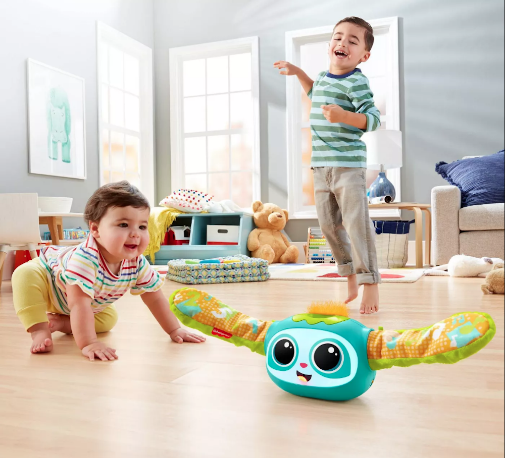 Baby chasing Fisher-Price Rovee