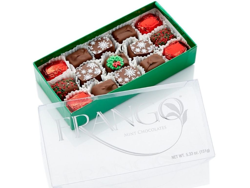 Frango Mint Chocolates with top opened revealing holiday decorated chocolates