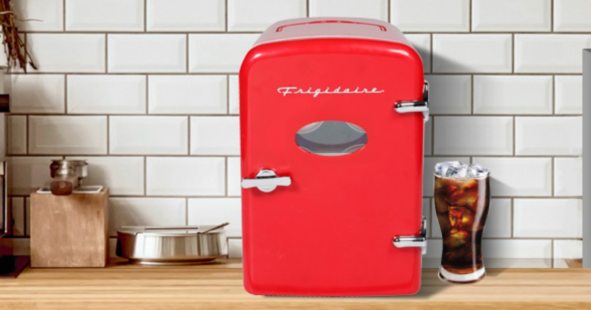 Small red fridge on a counter top