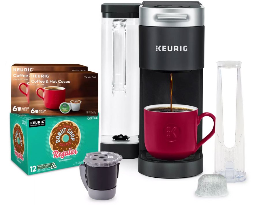 black keuring brewer with boxes of k-cups, refillable k-cup and water filter