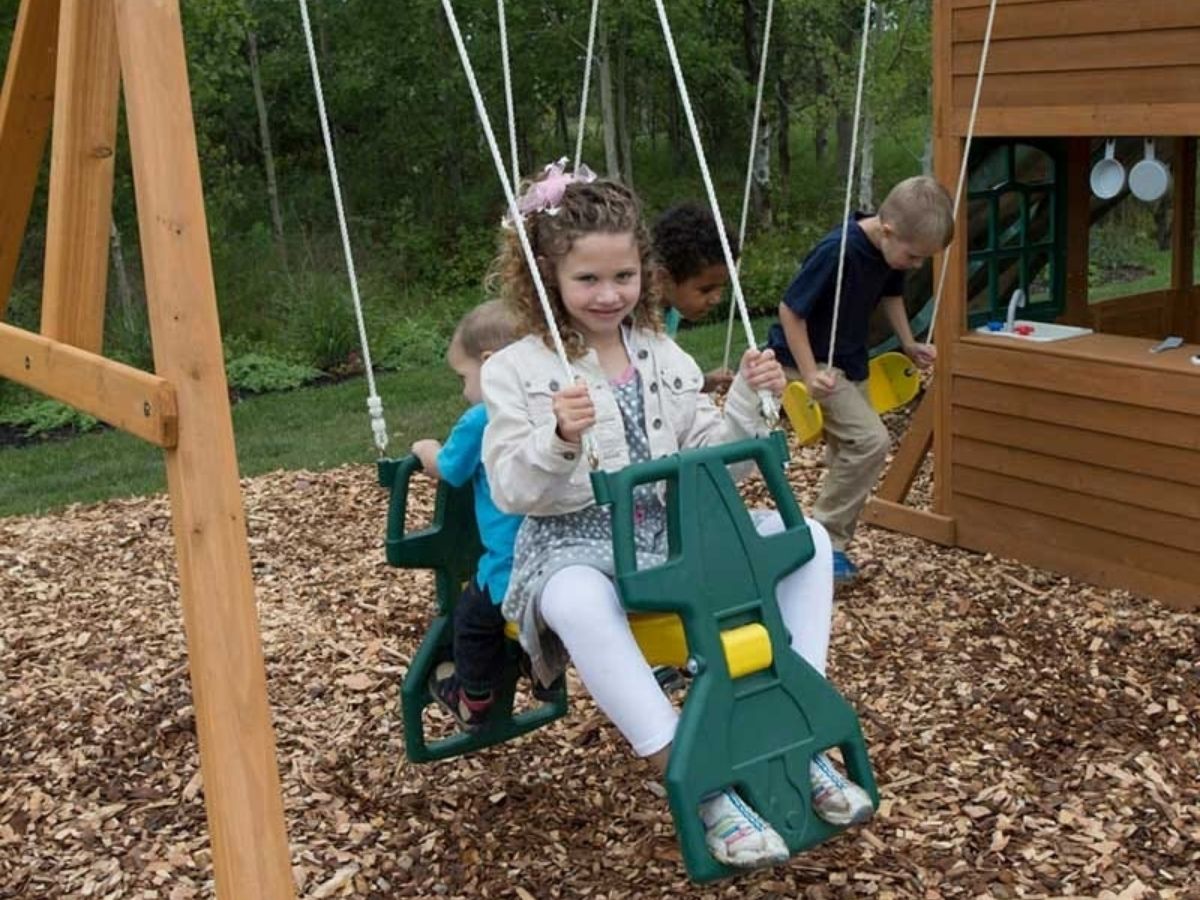 kids playing on Kidkraft Falcon Ridge Swing Set