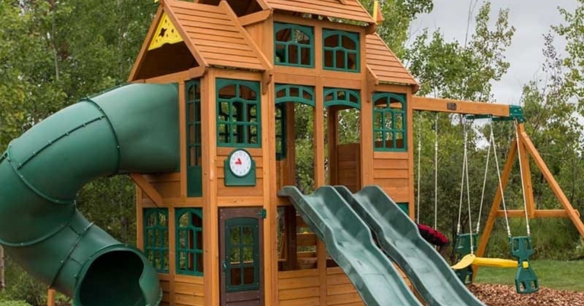 Kidkraft Falcon Ridge Swing Set outside in front of trees