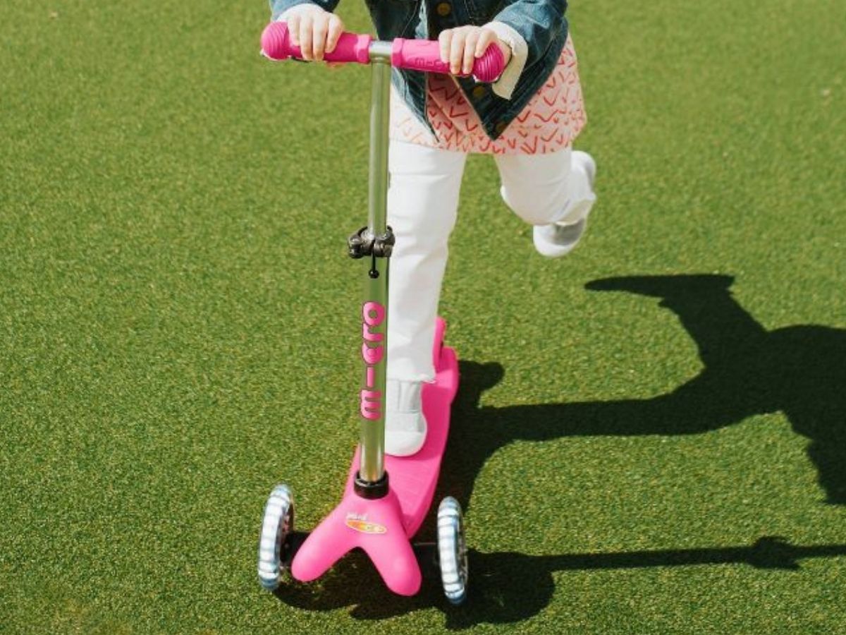 Little girl on a Microboard Scooter