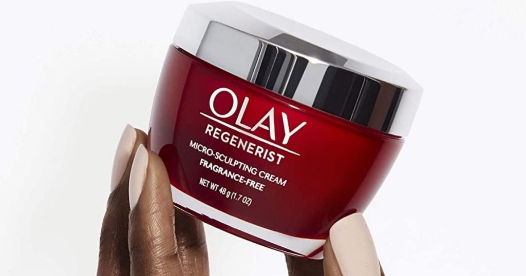 hand holding a jar of Olay Regenerist