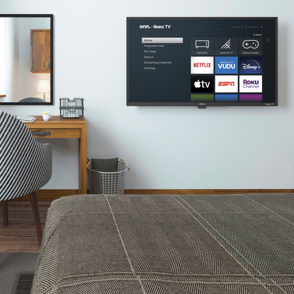 Onn Roku TV hanging on bedroom wall
