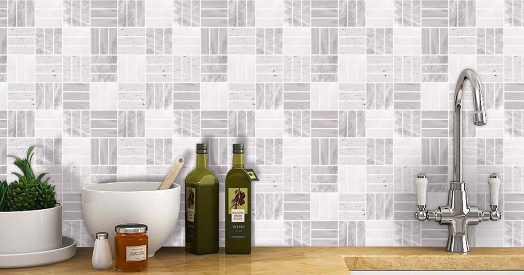 white and light grey peel and stick wall tiles on kitchen wall above counter