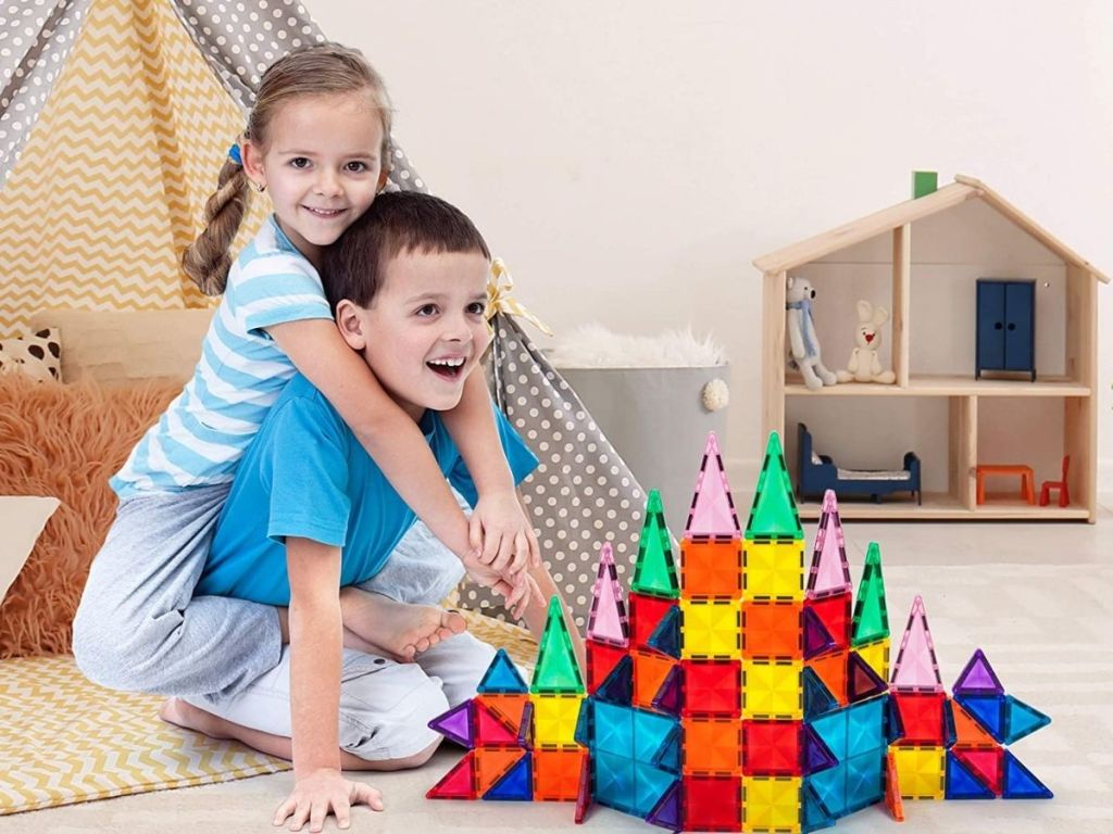 girl and boy playing with Picasso Tiles set