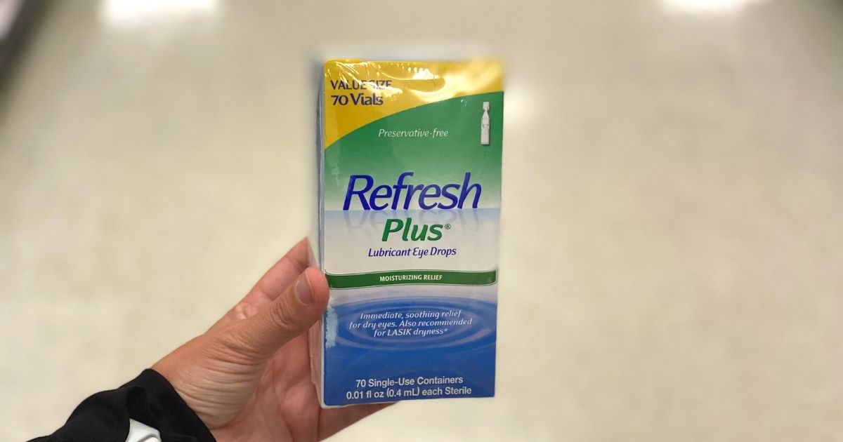 hand holding package of Refresh plus eye drops