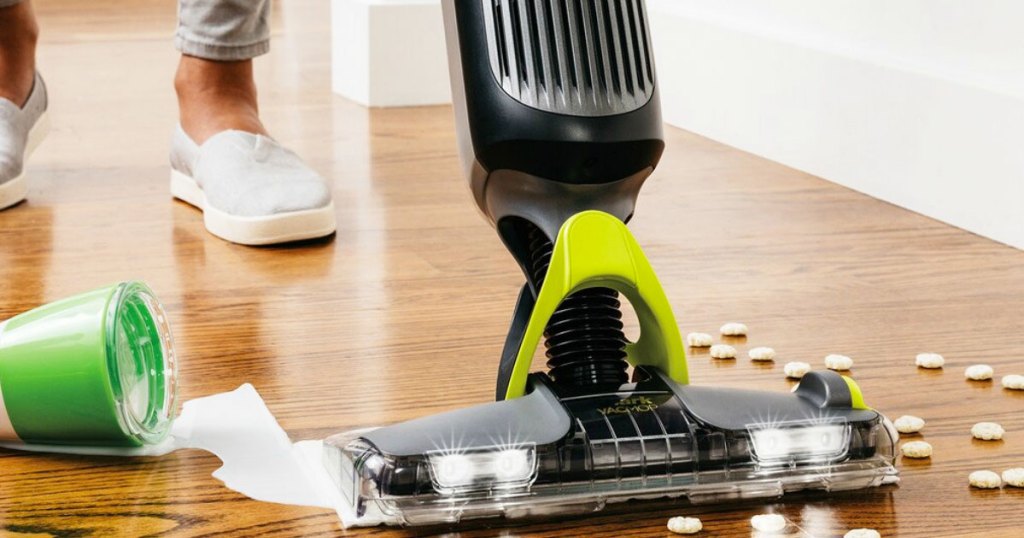 black and grey shark vacmop cleaning up spilled milk and cereal on hardwood floor