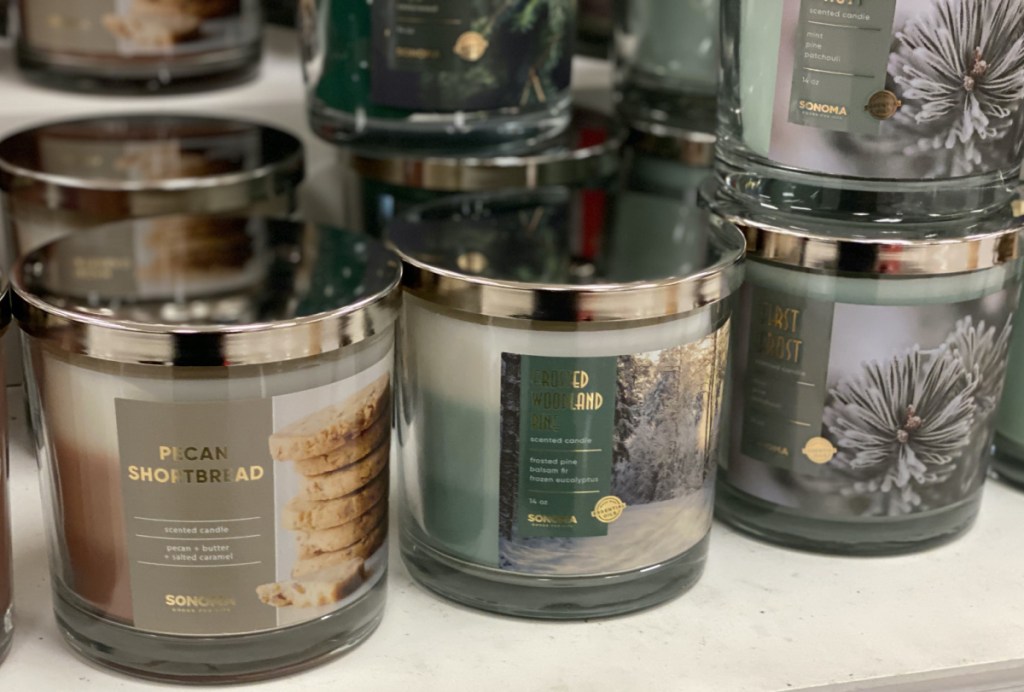 various scented jar candles on table in store