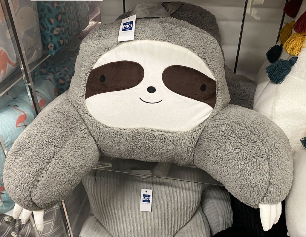 grey sloth shaped backrest pillow on display shelf at kohl's