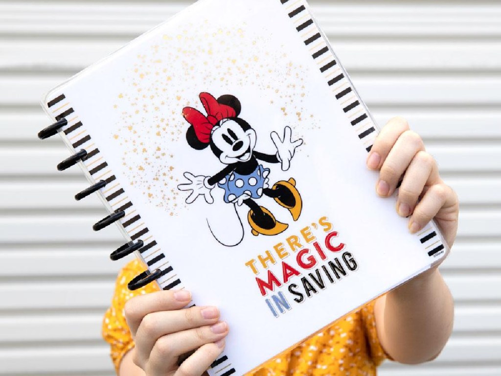 woman holding a minnie mouse The Happy Planner outside