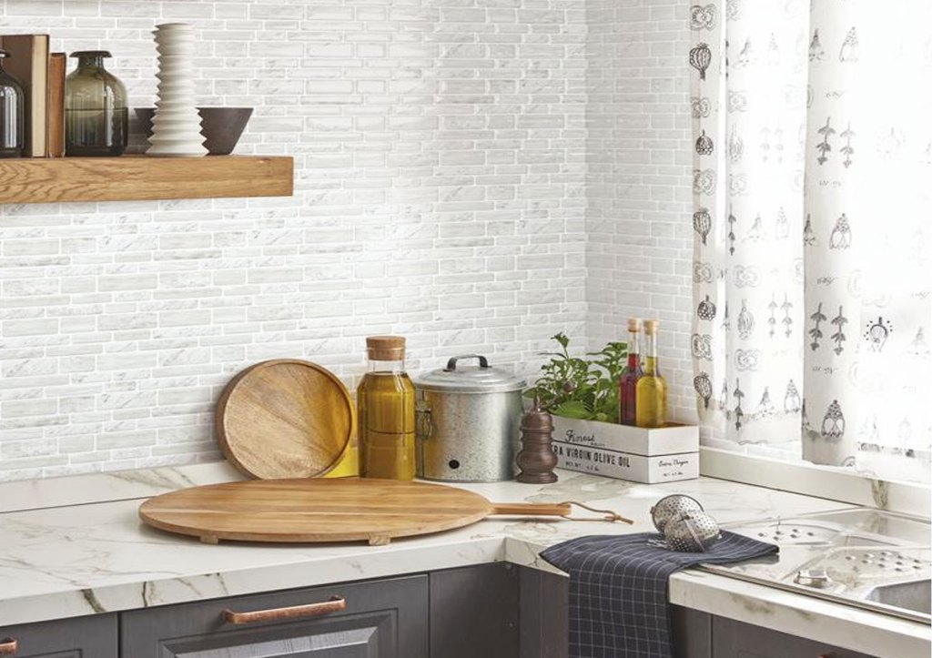 kitchen with grey and while peel and stick tiles on wall