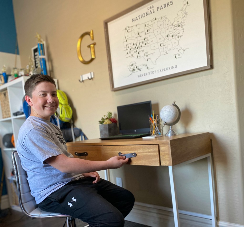 boy at desk with leather drawer pulls