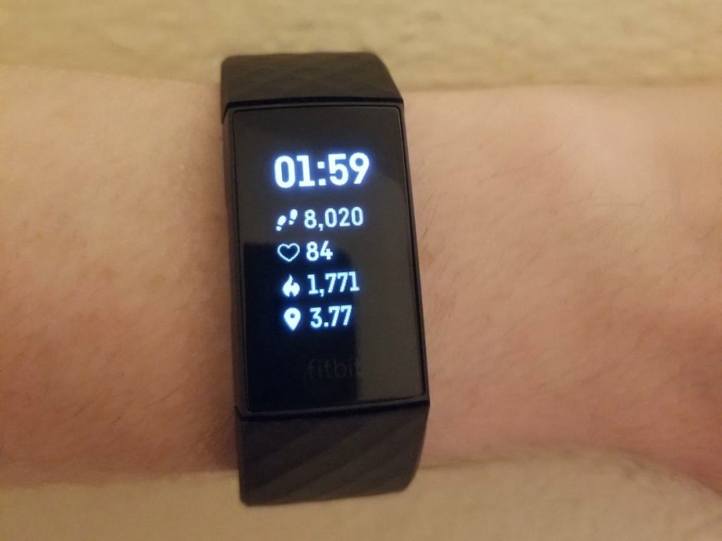 wrist wearing FitBit charge