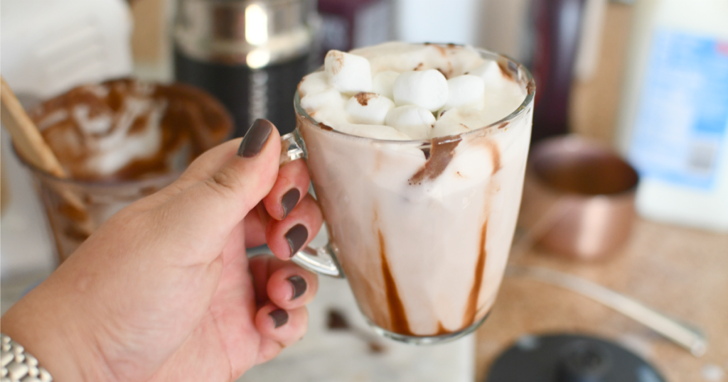 holding a whipped hot chocolate