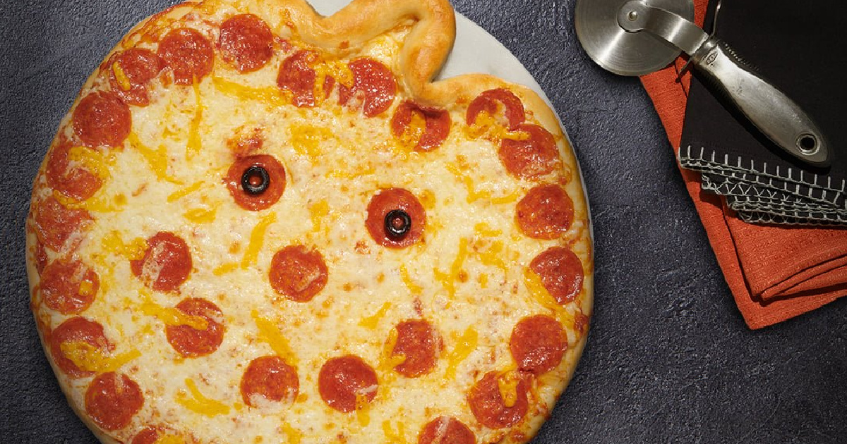 papa murphy's jack o pizza next to pizza cutter