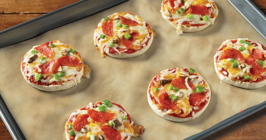 reynolds kitchens unbleached parchment paper with pizzas on it