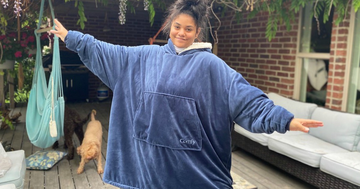 girl wearing a comfy wearable blanket standing outside